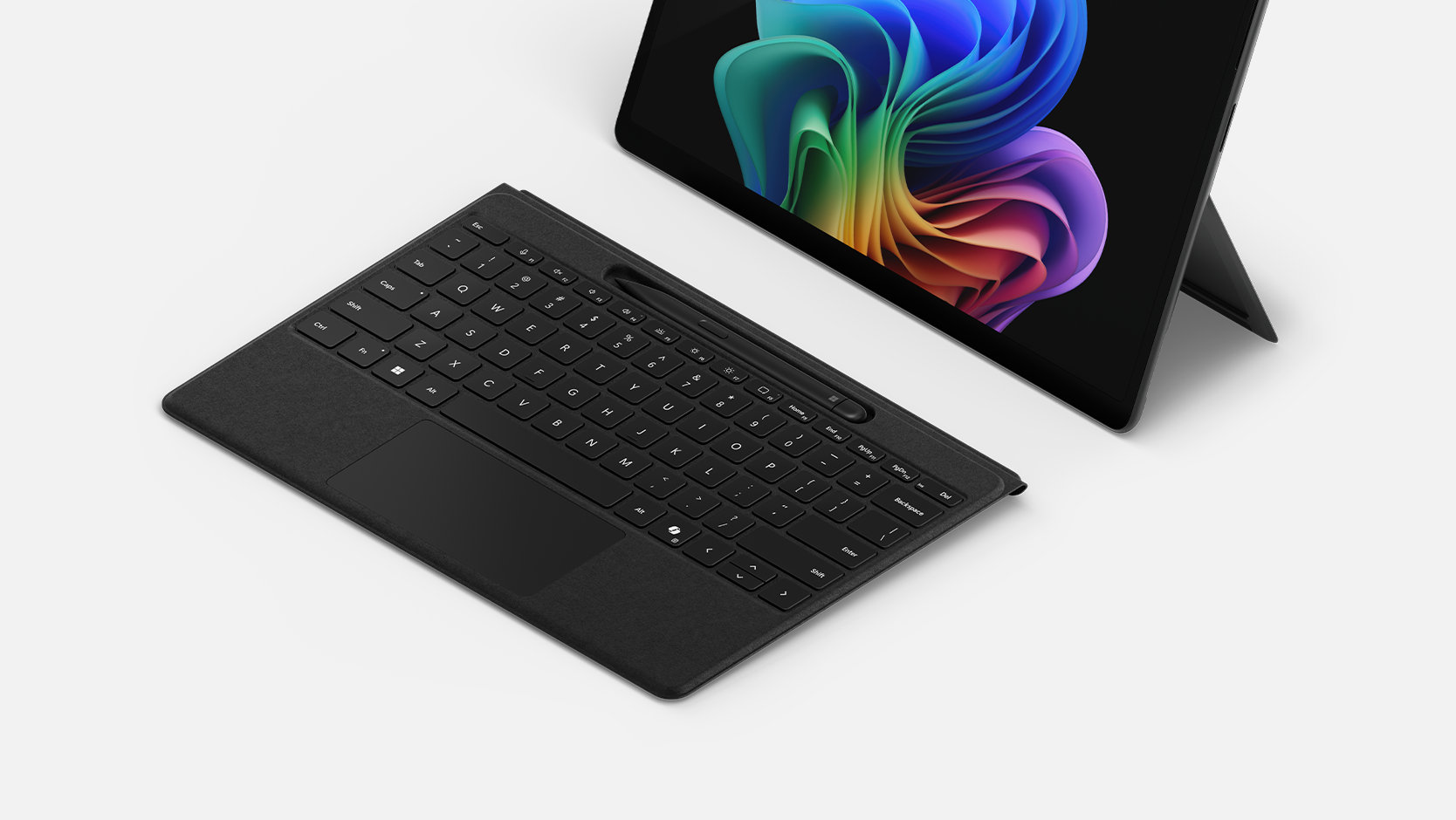 Black Surface Pro Flex Keyboard with included Slim Pen, detached high-angle view; tablet sold separately