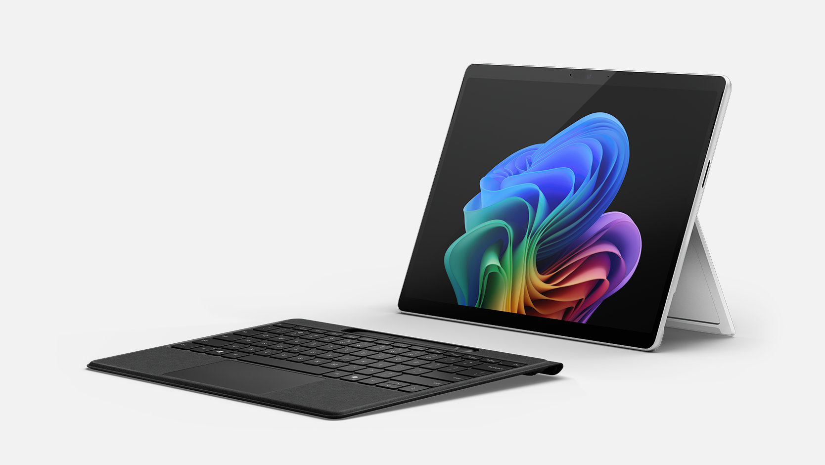 Black Surface Pro Flex Keyboard with included Slim Pen, detached low-angle view; tablet sold separately